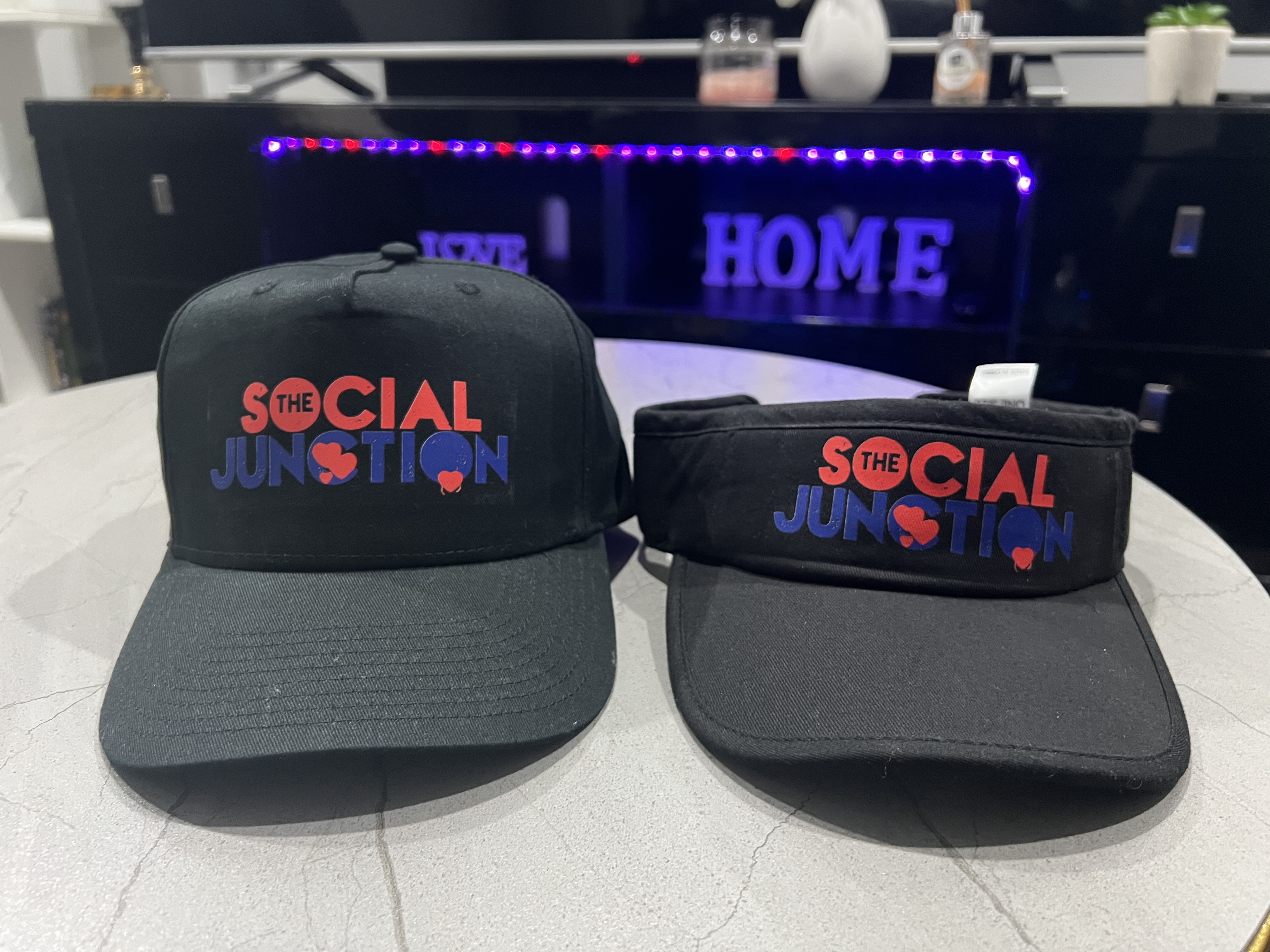 Black Social Junction caps with the signature logo